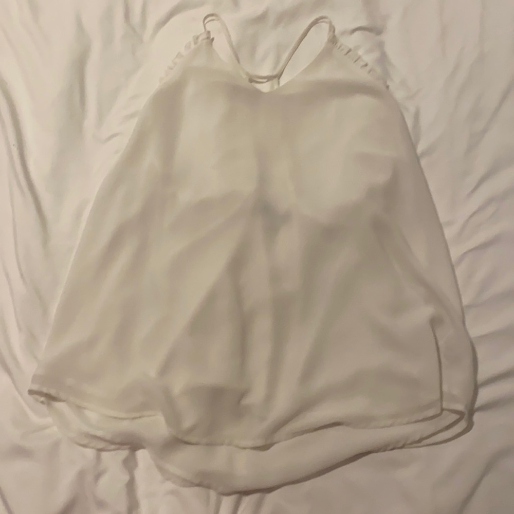 white boutique tank top with ruffle detail